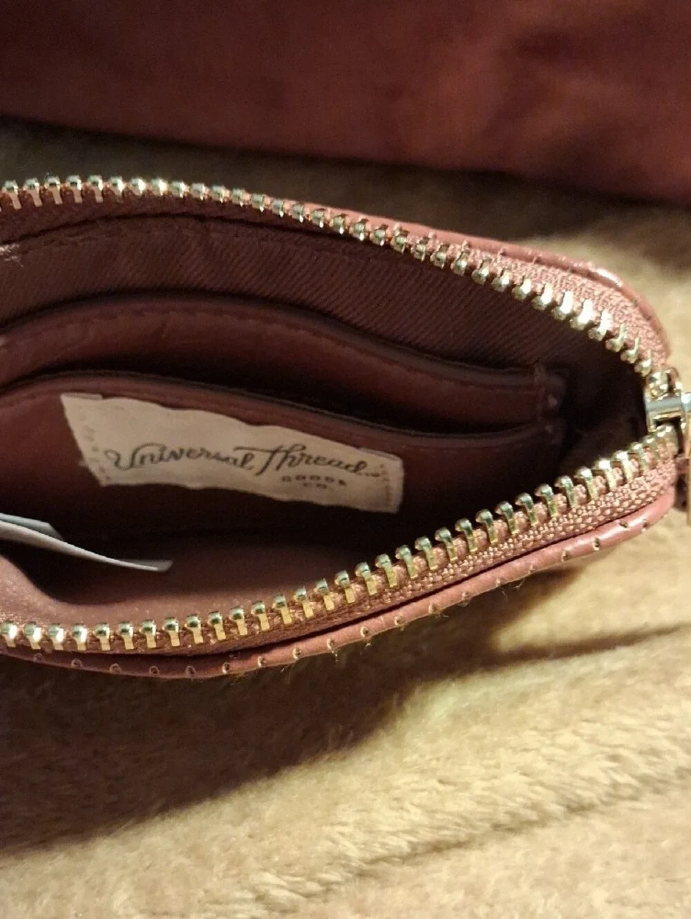 Universal Thread Perforated Wristlet in Mauve Pink
